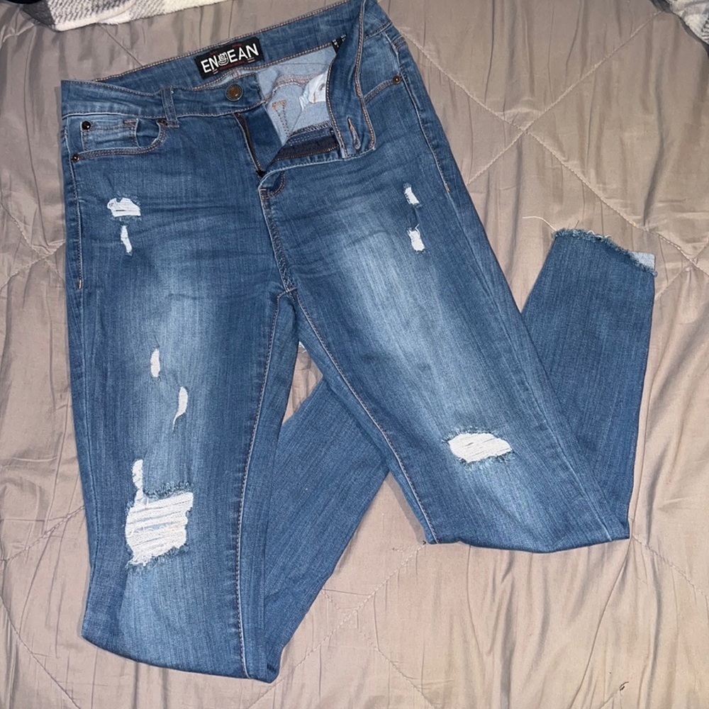 Faded light blue ripped jeans